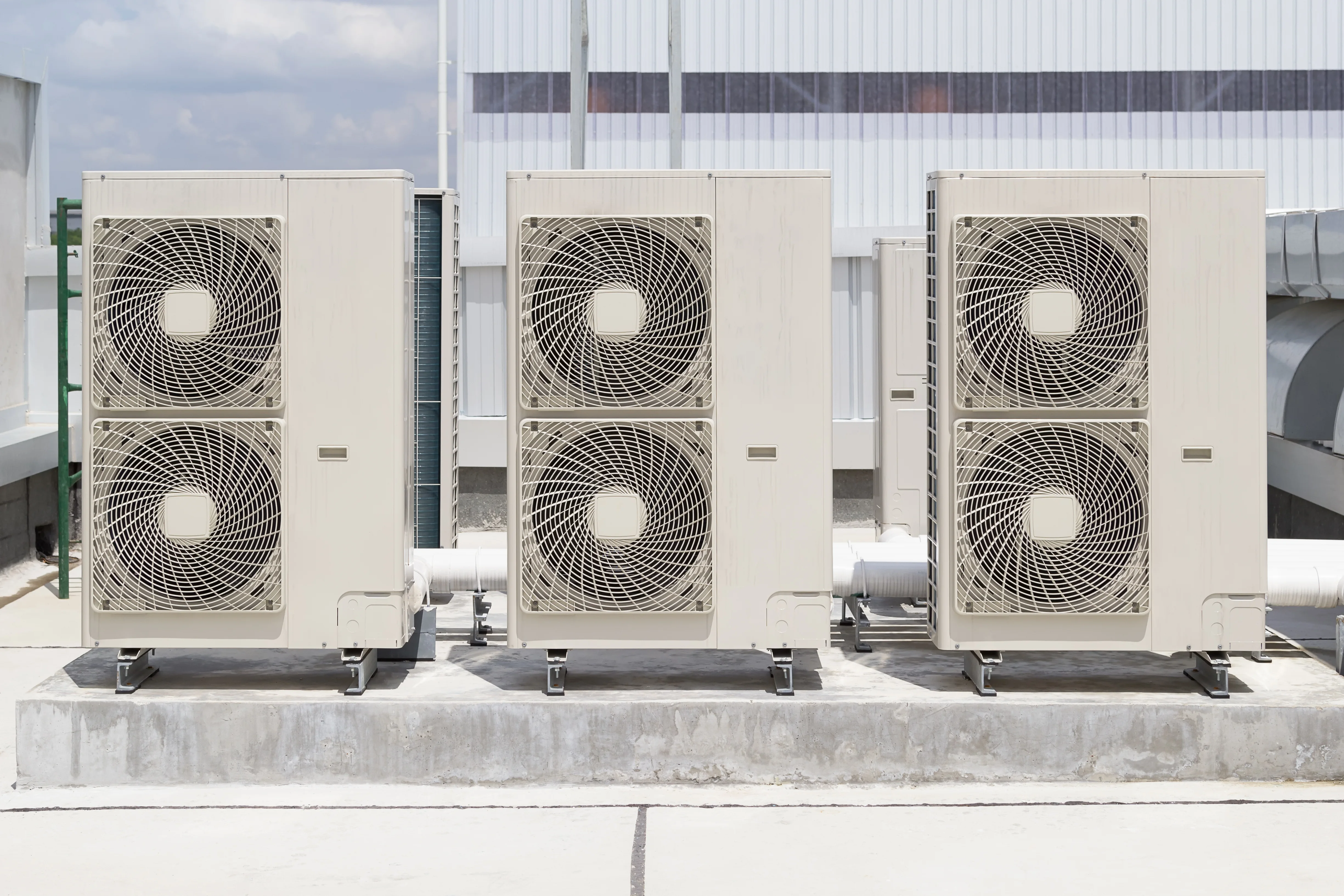 Rooftop HVAC units receiving professional commercial service in Phoenix.