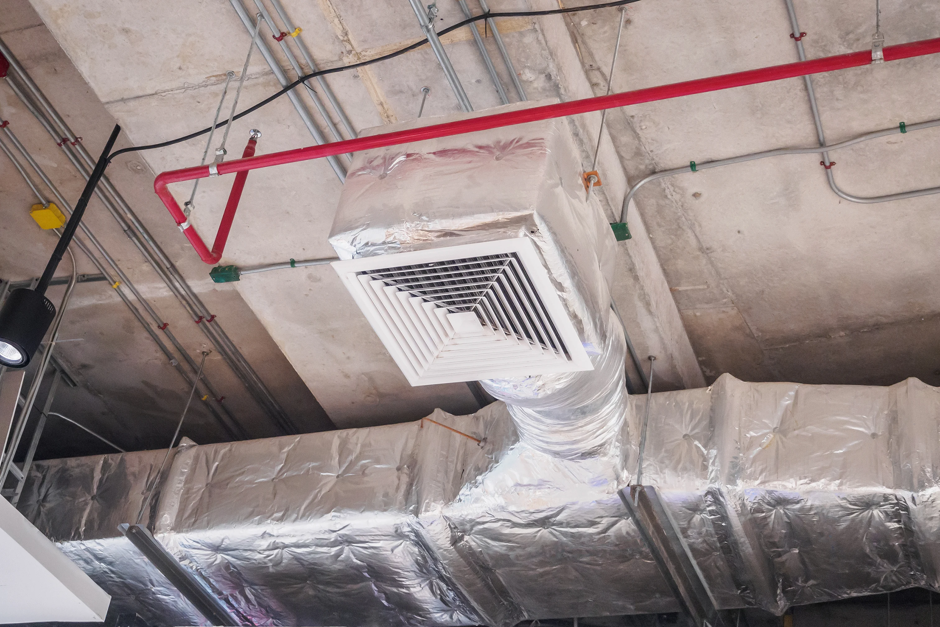 Insulated ductwork in a commercial facility, part of a comprehensive HVAC service in Phoenix.